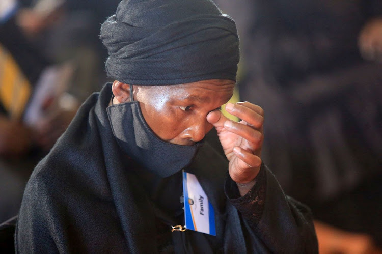Grieving mother Ntombizodwa Mtebeni wipes tears as she listens to tributes for her slain daughter Nosicelo, during a memorial service at UFH East London campus.