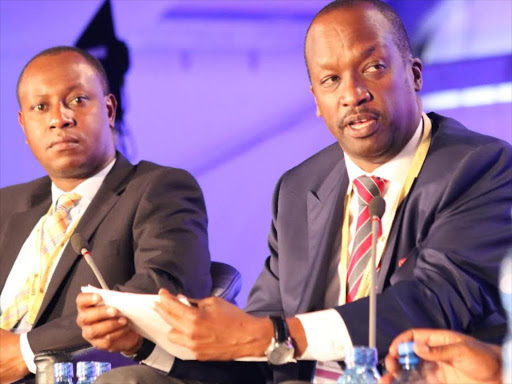 Radio Africa Chaiman and Kenya National Chamber of Commerce and Industry Chairman Kiprono Kittony (right) and Nairobi deputy Governor Jonathan Mueke address delegates during the third annual devolution conference at Meru National Polytechnic yesterday. MUTHOMI MWENDA