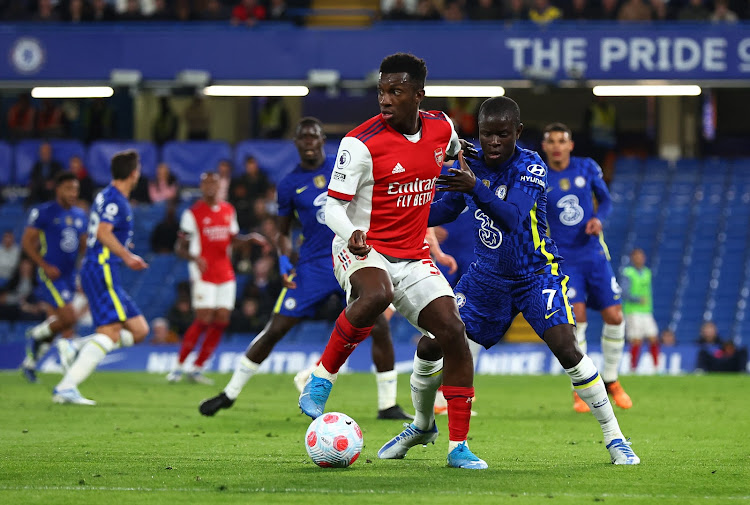 Arsenal's Eddie Nketiah in action with Chelsea's N'Golo Kante