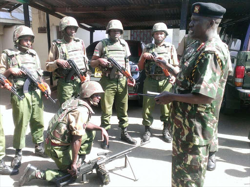 WE’RE COMING FOR YOU: Assistant IG Joseph Keitany (R) with a rapid-response team in Kisumu on June 10 last year.