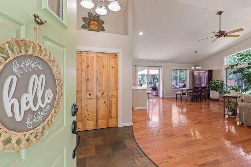 Entry door and open living room in this luxury house for sale in Bend ($584,900 - 148 m²)