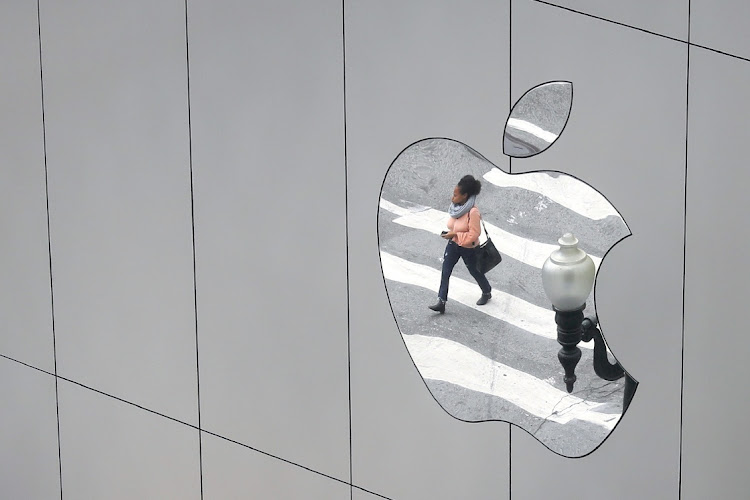 A woman is reflected in a Apple store logo in San Francisco, California, the US. Picture: KEVIN COOMBS/REUTERS