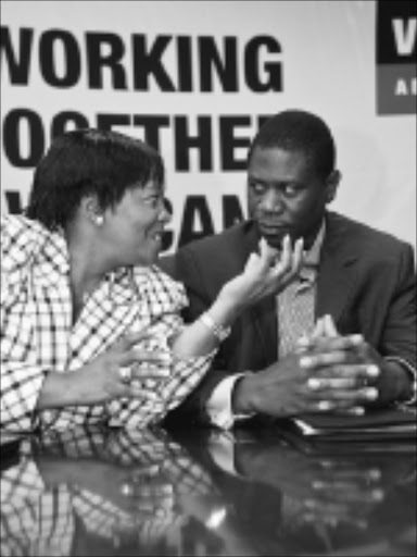 Nomvula Mokonyane ANC NEC member, Paul Mashatile Gauteng Premier addresses the media on the voter turn out for the province. Pic. Martin Rhodes.04/29/2009. © Business Day .