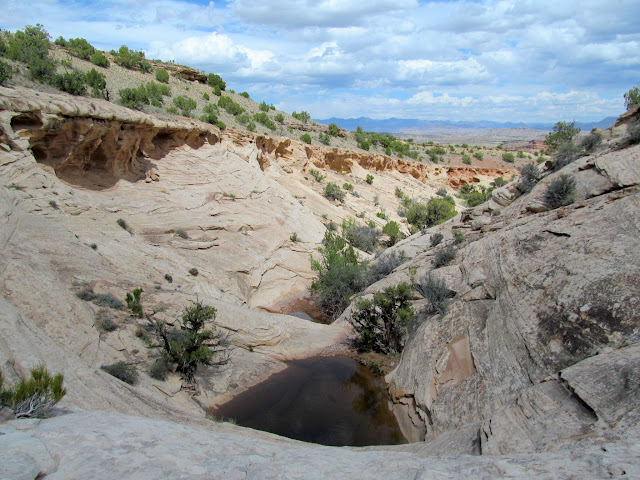 Descending another pothole-filled drainage