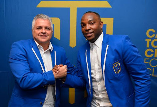 Cape Town City FC chairman John Comitis (L) newly appointed head coach Benni McCarthy (R) pose for photos during the unveiling of their new boss at Radisson Blu Hotel on June 13, 2017 in Cape Town, South Africa.