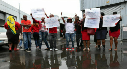 Cosatu members proteste outside factories in Sydney Road, Durban, where managers are accused of strip searching workers PICTURE: JACKIE CLAUSEN