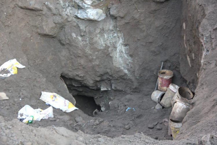 Community members at Ga-Maroga village near Burgersfort dug this hole to retrieve the bodies of eight suspected illegal miners who were trapped while allegedly mining for chrome on Friday.