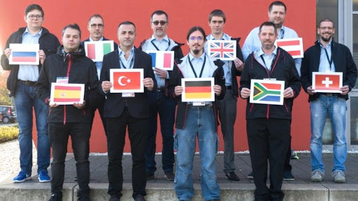 The top 10 service engineers participating in the European leg of the global service awards. Christiaan Pelser from Page Automation, holding the South African flag, was awarded first place.