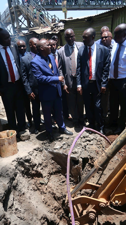 Water and Sanitation principal secretary Dr Paul Rono with other senior officials during crackdown on illegal water connections at Kiamaiko in Nairobi on March 6, 2023./WINNY WANJIKU