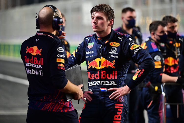 Max Verstappen of Netherlands and Red Bull Racing talks with race engineer Gianpiero Lambiase during a red flag delay during the F1 Grand Prix of Saudi Arabia at Jeddah Corniche Circuit on December 05, 2021 in Jeddah, Saudi Arabia