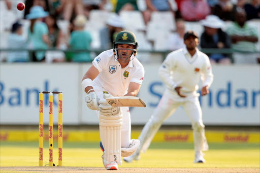 South African batsman Dean Elgar plays a shot during the second Test between South Africa and Sri Lanka on January 3, 2017 at Newlands Cricket Stadium in Cape Town.