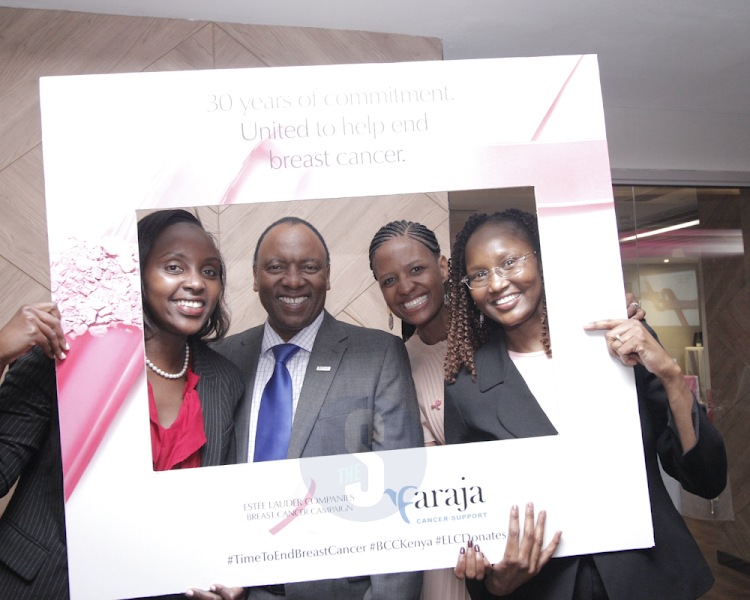 Catherine Karita, Tom Gitogo, Mulalo Moroe, Diane Korir, Kagwe Mungai Joram Theuri and Dennis Gikunda take a photo op during the launch of the breast cancer campaign.