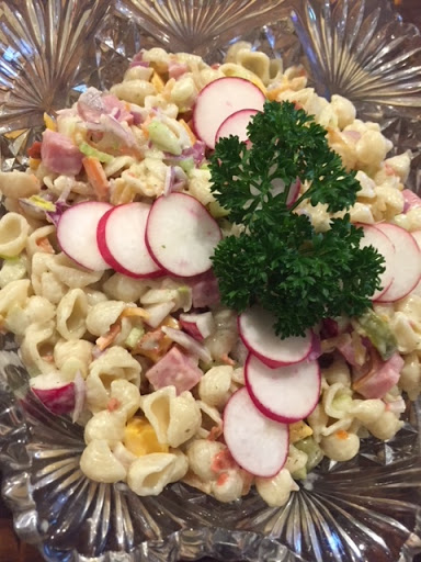 A meal-in-one pasta salad garnished and ready to serve.