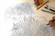 Artist Emma Farrarons creating an illustration for others to colour in.