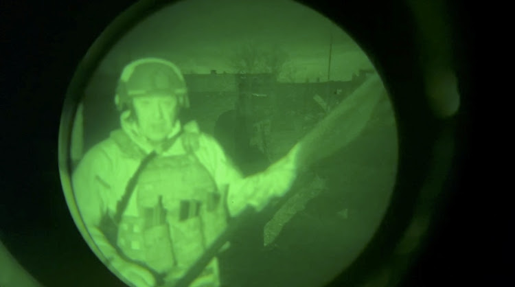 Yevgeny Prigozhin, founder of Russia's Wagner mercenary force, speaks in a video message that was allegedly filmed near the city administration building in Bakhmut, Ukraine, in this still image from an undated video filmed through a night vision device and released on April 3, 2023.