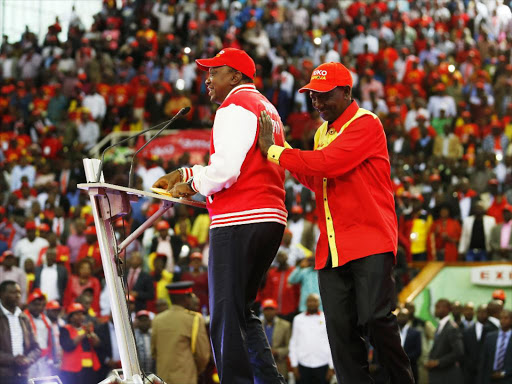 Jubilee leaders President Uhuru Kenyatta and Deputy President William Ruto during the launch of the party manifesto at Kasarani Stadium on June 27 last year /ENOS TECHE