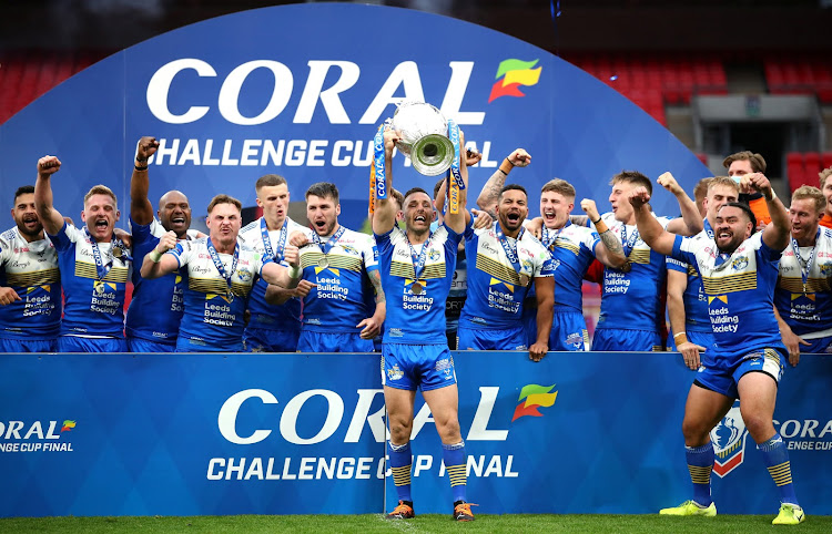 Luke Gale of Leeds Rhinos celebrates with the trophy following the Coral Challenge Cup final win over Salford Red Devils at Wembley Stadium in London on October 17, 2020.