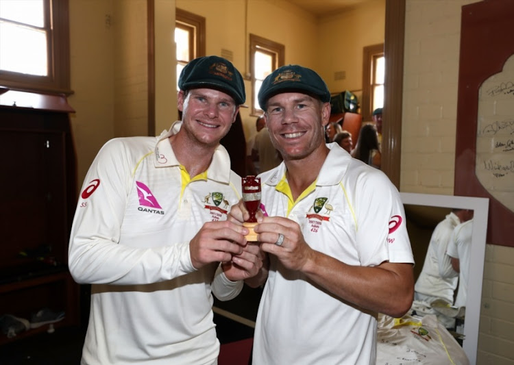 Steve Smith and David Warner of Australia celebrate with the Ashes Urn in the change rooms during day five of the Fifth Test match in the 2017/18 Ashes Series between Australia and England at Sydney Cricket Ground on January 8, 2018 in Sydney, Australia.