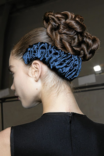 An upside down headband is a quirky - and trendy way - to accessorise your boulangerie hair bun.