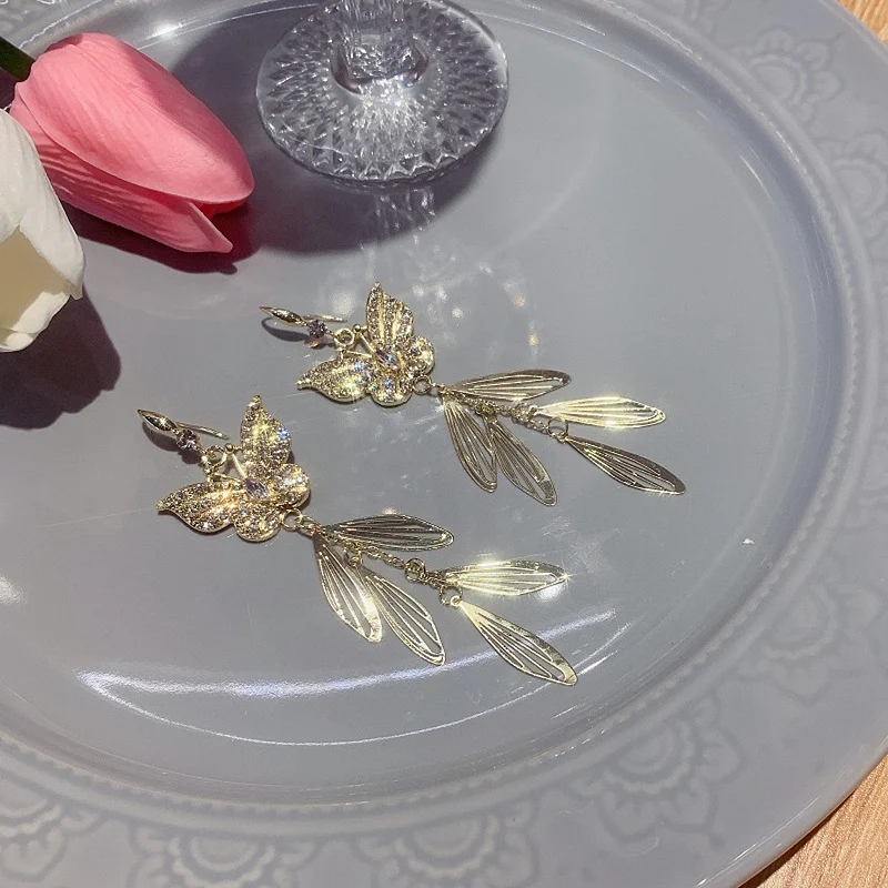 Long Butterfly Tassel Earrings. Elevate your style with these elegant, dangling earrings, designed to add movement and s