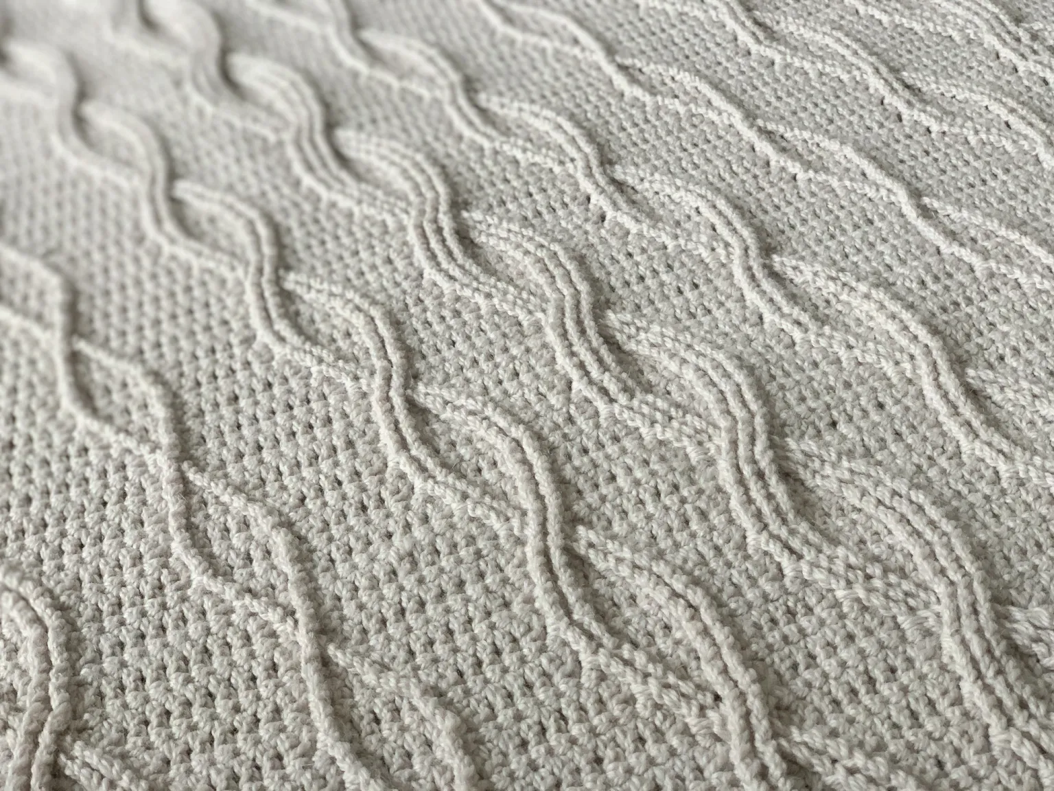 crochet blanket with crossed cable stitches