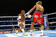 Zolani Tete  punches John Reil Casimero during their WBO world bantamweight championship  on November 30 2019 in  England. 