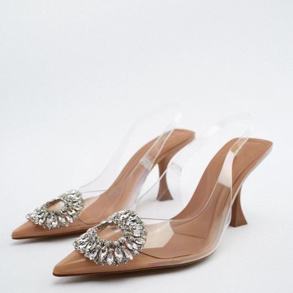 Za Shoes ženske sandale na štiklu, prozirne, sa kaišem pozadi, ukrašene vodenim dijamantima i zatvorenim prstima. Elegantne i moderne.