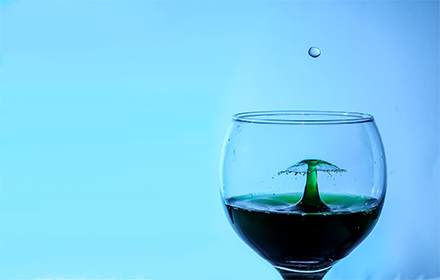 Drop of water in a wine glass. small promo image