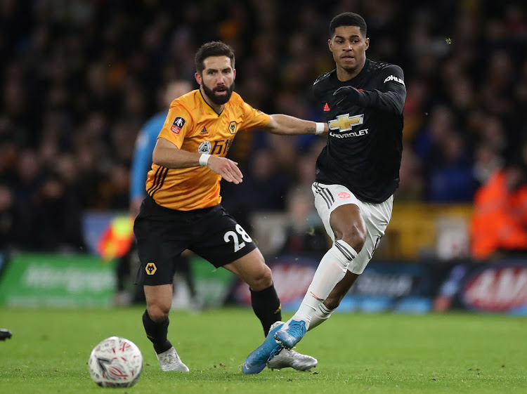 Manchester United's Marcus Rashford in action with Wolverhampton Wanderers' Joao Moutinho