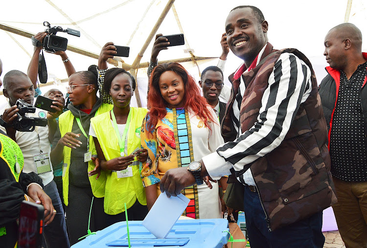 ANC gubernatorial candidate in Kakamega race Cleophas Malala casts his vote at Bukhungu stadium polling staion n Monday. He was accompanied by his wife Caroline Malala.