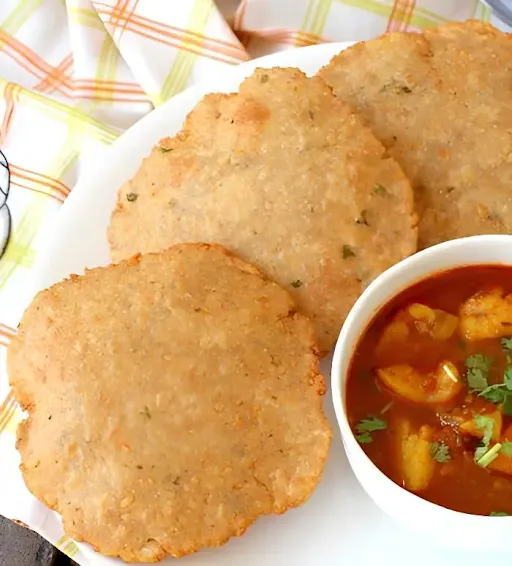 10 Atta Poori + Aloo Sabji + Matar Pulao + Spl. Boondi Raita