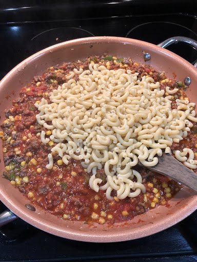 Stir cooked macaroni into prepared sauce