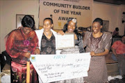 Honoured: This ecstatic foursome are all smiles after receiving their prizes