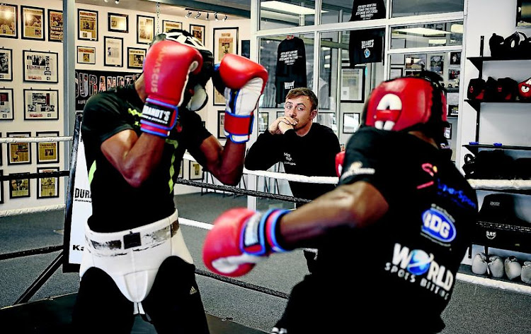 Damien Durandt watches two boxes in a sparring session.