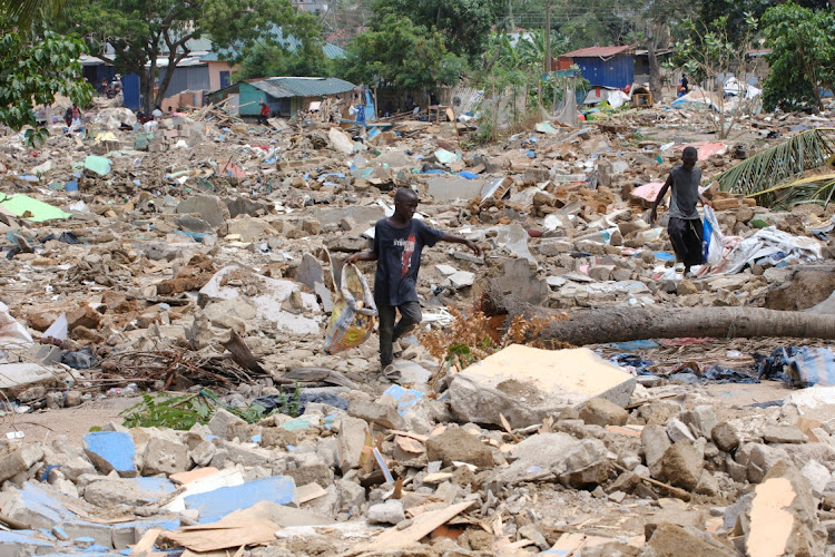 People scavenge through the rubble as homes are demolished at the Buduburam Refugee Camp in the Gomoa East District, Central Region, Ghana on March 4 2024. Picture: REUTERS/FRANCIS KOKOROKO