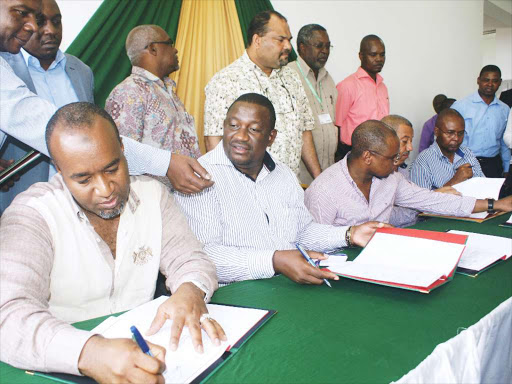 TAKING A GIANT STEP FORWARD: Governors Hassan Joho( Mombasa) , Salim Muvrya (Kwale), Amazon Kingi (Kilifi), Issa Timami (Lamu) and John Mruttu (Taita Taveta) during the signing of an MoU between the coast county governments of Jumuia ya Kaunti za Pwani and Universities at Technical University of Mombasa on January 23, 2015 Photo/file