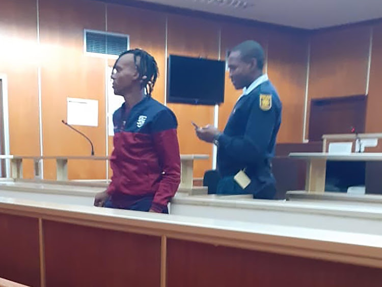 Aviwe Mbane is led to the holding cells after being found guilty of raping a 12-year-old girl by the East London regional court on Monday.