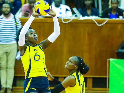 Kenya Prisons’ Joy Luseneka and Edith Wisa in action during the KVF national league play-offs at the Moi Stadium, Kasarani on Monday / OLIVER MORGAN