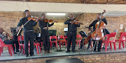 Members of Thuthukani Orchestra performing in Soweto.
