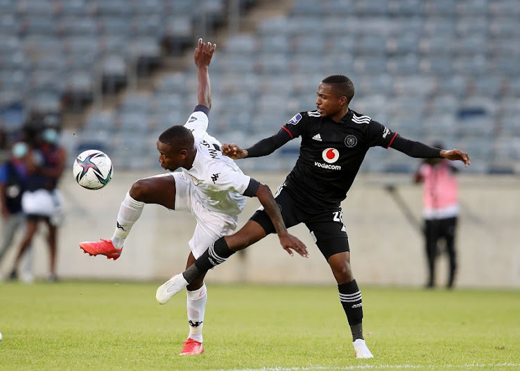 Vusimuzi Mncube of Sekhukhune United challenged by Bandile Shandu of Orlando Pirates during the DStv Premiership match between Orlando Pirates and Sekhukhune United at Orlando Stadium on November 02, 2021 in Johannesburg, South Africa.