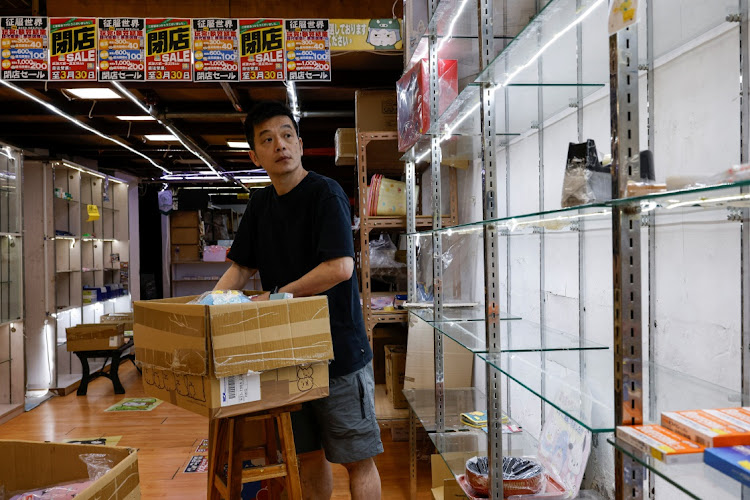 Jacky Yu, owner of the Japanese gift shop, packs merchandise after it closed down in Mongkok, in Hong Kong, China April 23, 2024.