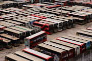 Kowloon Motor Bus (KMB) double-decker buses are seen parked at a bus depot, after services were cut as coronavirus disease (Covid-19) cases surge in Hong Kong, China, March 3, 2022.  