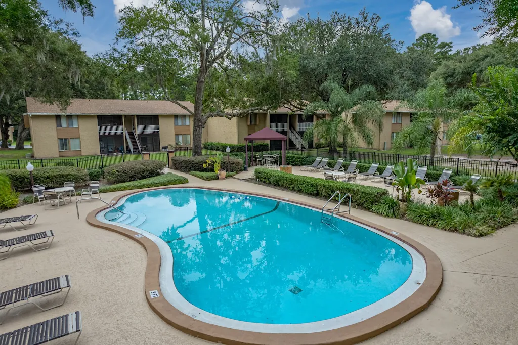 Community pool surrounded by lounge chairs