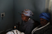 Nkule Khenisa and Thozo Shabalala at home mourning the passing of Sanele Khenisa, who was among seven victims shot and killed at a tuck shop in Savannah Park.