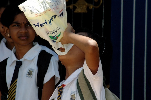 A young girl drinks water out of a bottle in Sri Lanka's eastern Batticaloa District, where over 220,000 persons have been affected by the drought. Credit: Amantha Perera/IPS