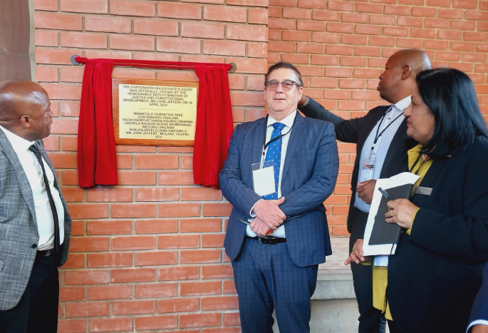 Officials unveiling a plaque at the official opening of the Chatsworth magistrate's court premises.