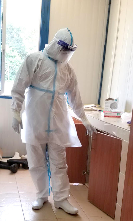 Nurse Leonard Omollo prepares to attend to his duties at Siaya County Referral Hospital.