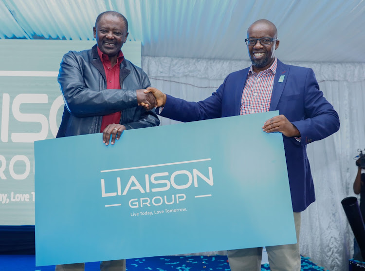 Group managing director Liaison Group Tom Mulwa and chairman . Wachira Mahihu unveil the new brand identity