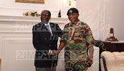 President Robert Mugabe poses with General Constantino Chiwenga at State House in Harare, Zimbabwe, November 16, 2017. 