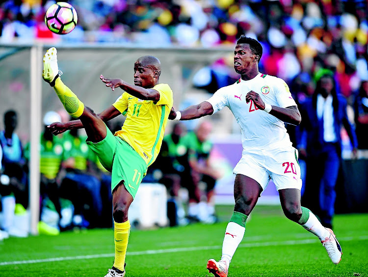 Thabo Matlaba of South Africa challenged by Keita Balde of Senegal during 2018 World Cup Qualifiers match between South Africa and Senegal at Peter Mokab Stadium, November on the 12 November 2016 © / Samuel Shivambu / BackpagePix